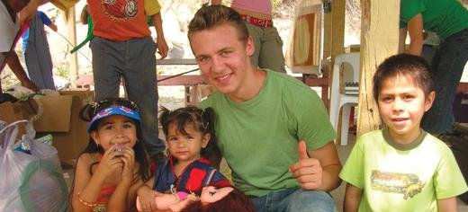Family International volunteer Mike with three new Mexican friends during Children’s Day