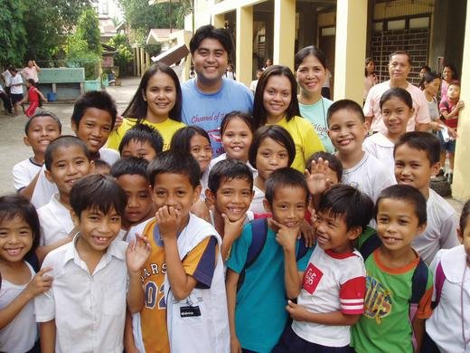 These children from Banilad Elementary School in Mandaue City were once afraid of dentists. Now they are proud of their shining smiles and look forward to their next checkup and cleaning. Pictured with the children (back row, from left): Dr. Mona Rica Melicio, Dr. Dino Natividad, Dr. Cathrine Enriquez, Marie Tangalin from the Family International (daily leader of the clinic); looking on from the back at the far right is the school principal, Mr. Alehandro Lamdagan.